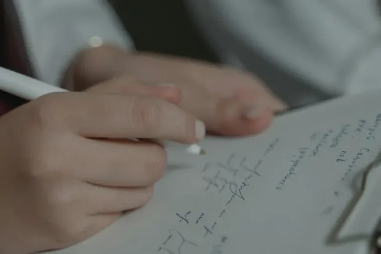 hands on a clipboard representing National Clinical Psychology Medico-Legal reports